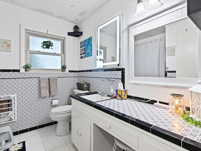 bathroom featuring tile patterned floors, a textured ceiling, heating unit, tile walls, and toilet