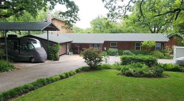 single story home with a carport and a front yard