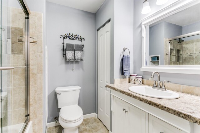 bathroom with walk in shower, toilet, tile patterned floors, and vanity