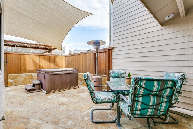 view of patio with a hot tub