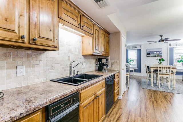 kitchen featuring light hardwood / wood-style flooring, plenty of natural light, black appliances, and ceiling fan