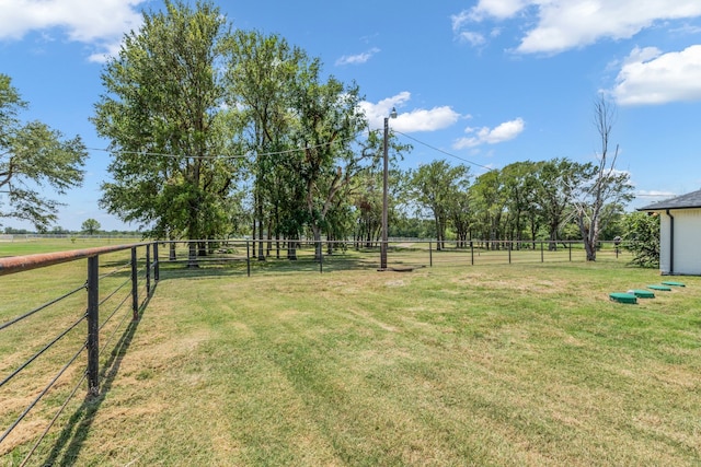 view of yard with a rural view