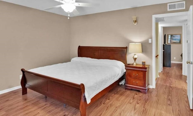 bedroom featuring ceiling fan and light hardwood / wood-style floors