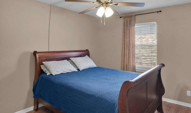 bedroom with hardwood / wood-style flooring and ceiling fan