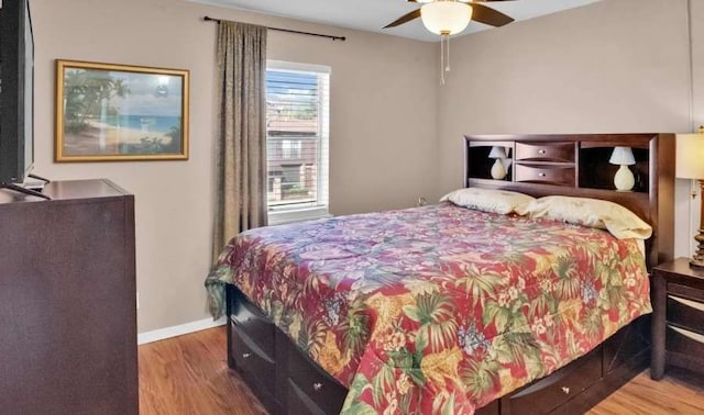 bedroom with ceiling fan and hardwood / wood-style flooring