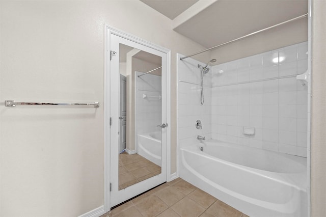 bathroom featuring tiled shower / bath and tile patterned flooring