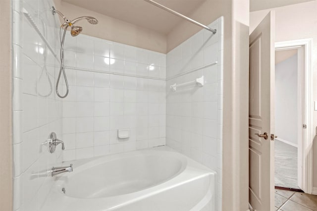 bathroom with tile patterned floors and tiled shower / bath