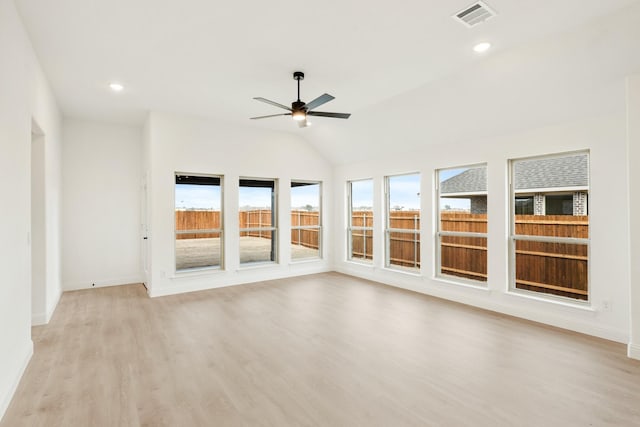 unfurnished sunroom with ceiling fan and lofted ceiling