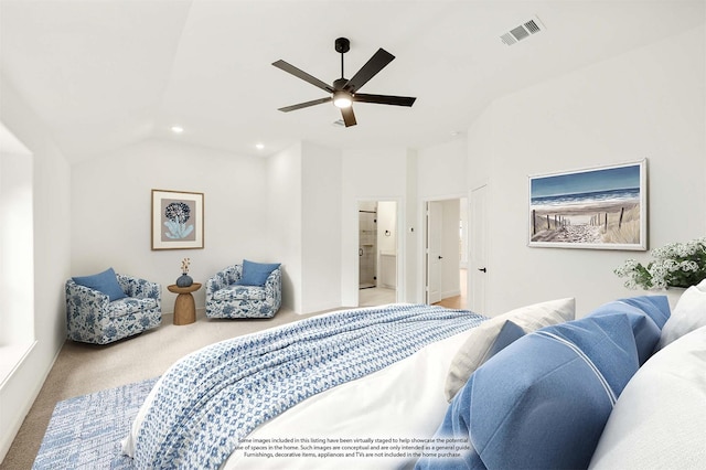 bedroom with light carpet, ensuite bathroom, lofted ceiling, and ceiling fan