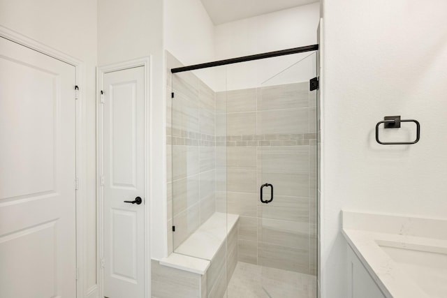 bathroom with vanity and walk in shower