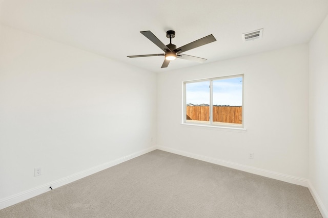 carpeted empty room with ceiling fan