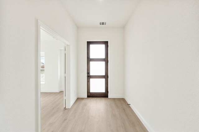 hall featuring light hardwood / wood-style floors