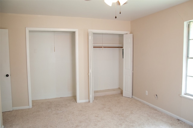 unfurnished bedroom featuring light colored carpet