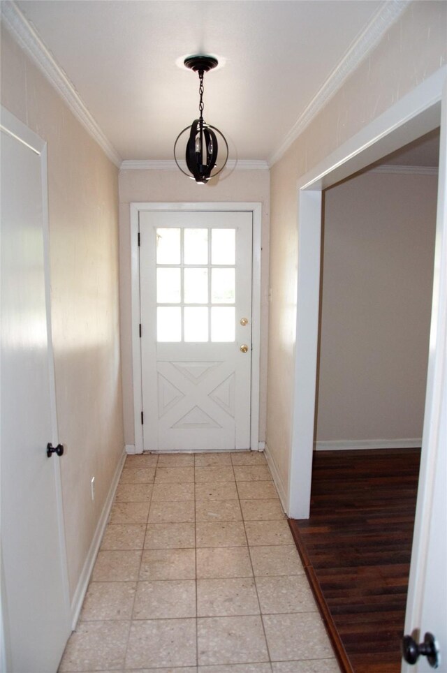 doorway with crown molding and light hardwood / wood-style flooring