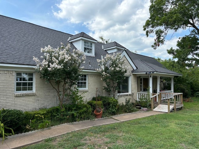 view of front of house with a front lawn and a porch