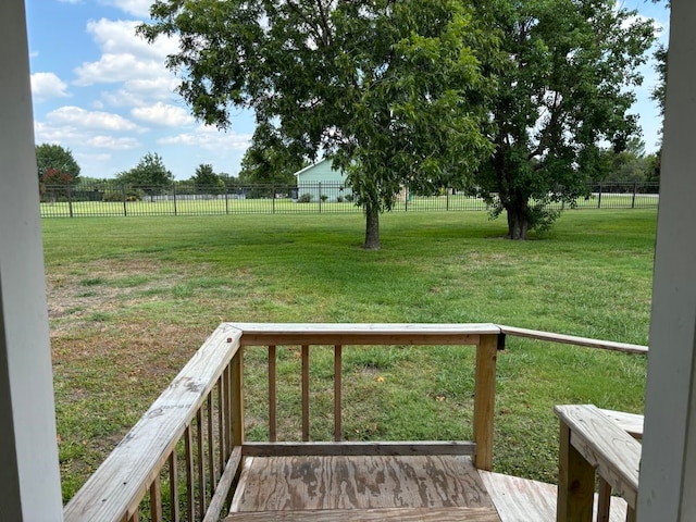 view of yard featuring a rural view and a deck