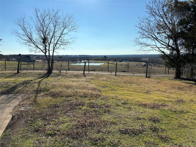 view of yard with a rural view