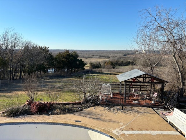 view of yard with a rural view and a gazebo