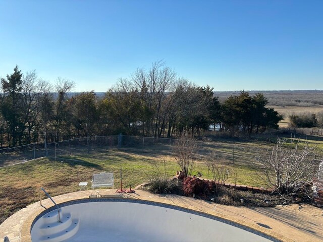 view of yard with a rural view