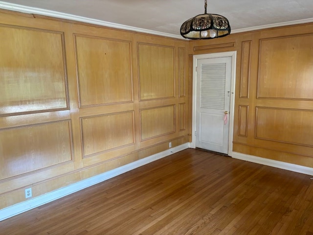 interior space with dark wood-type flooring and crown molding