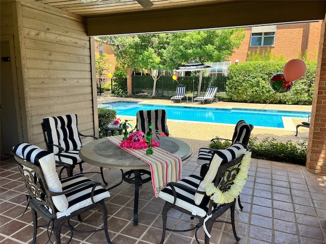 view of swimming pool featuring a patio