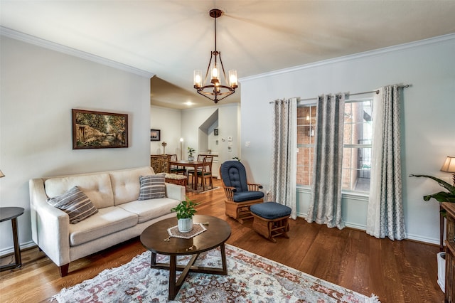 living room with an inviting chandelier, ornamental molding, and wood-type flooring