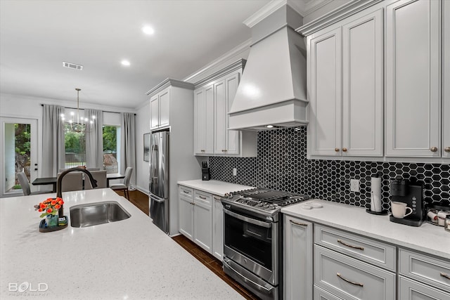 kitchen with light stone countertops, sink, stainless steel appliances, and custom exhaust hood