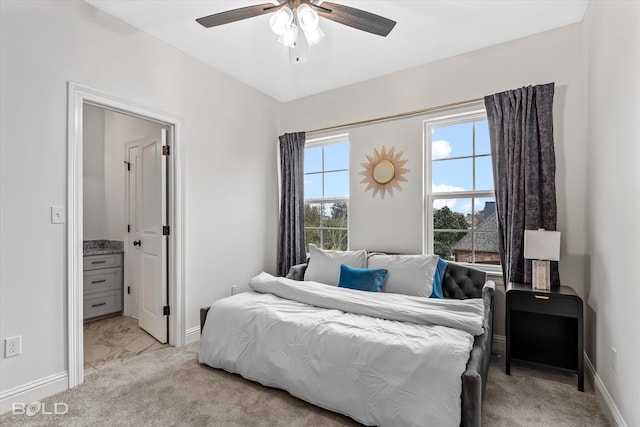 bedroom featuring light colored carpet and ceiling fan