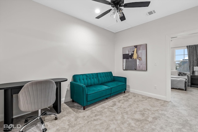 carpeted office with ceiling fan