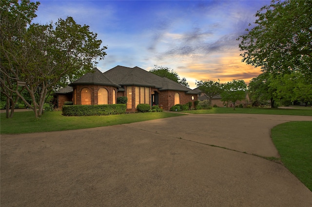 view of front of house with a yard