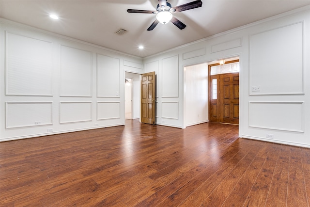 spare room featuring dark hardwood / wood-style flooring and ceiling fan