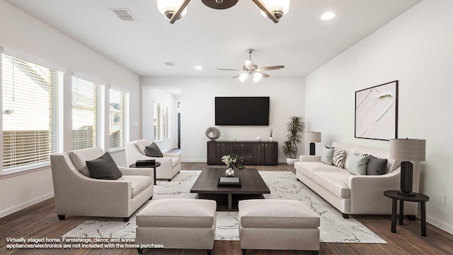 living room with wood-type flooring and ceiling fan