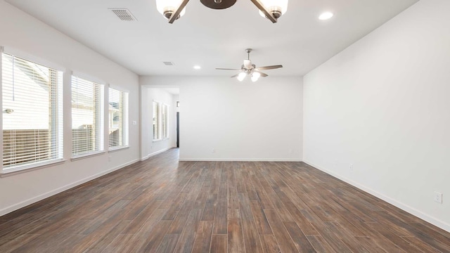 unfurnished room with dark hardwood / wood-style floors and ceiling fan