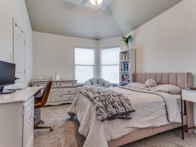 carpeted bedroom featuring vaulted ceiling and ceiling fan