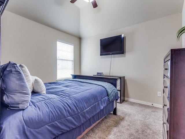 carpeted bedroom featuring lofted ceiling and ceiling fan