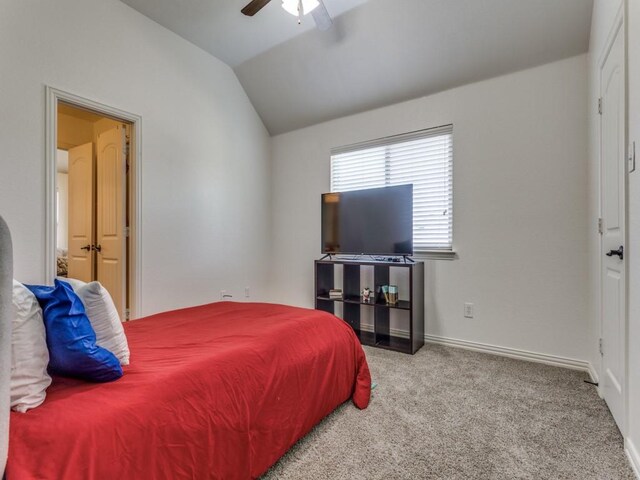 carpeted bedroom featuring lofted ceiling and ceiling fan