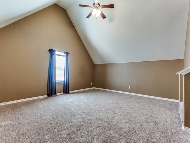 additional living space with carpet, lofted ceiling, and ceiling fan