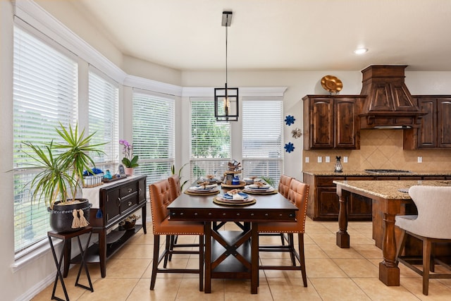 dining room featuring light tile patterned floors and recessed lighting