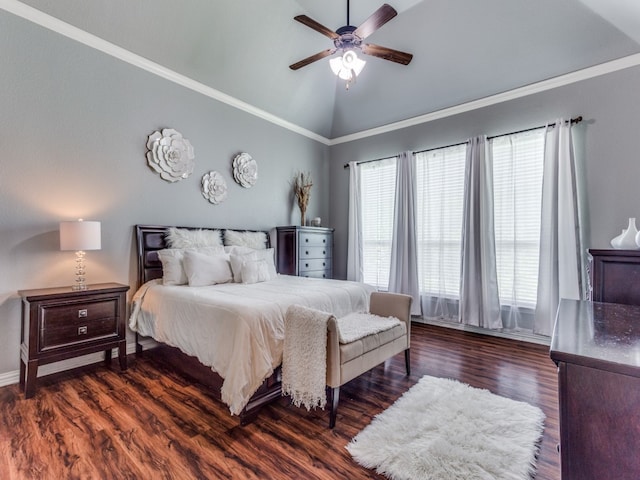 bedroom featuring ornamental molding, lofted ceiling, ceiling fan, and dark wood-type flooring