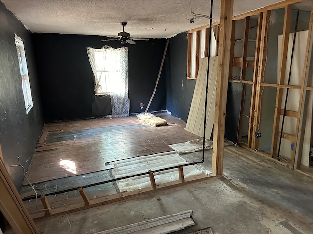 spare room with ceiling fan and a textured ceiling