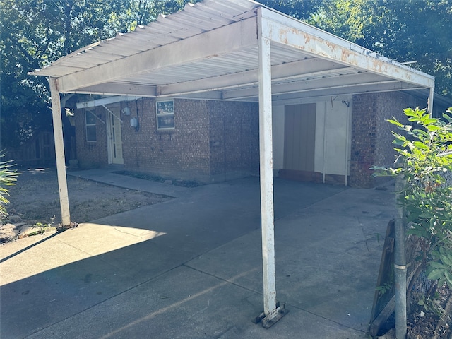 view of parking / parking lot with a carport