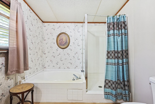 bathroom featuring separate shower and tub, a textured ceiling, and toilet