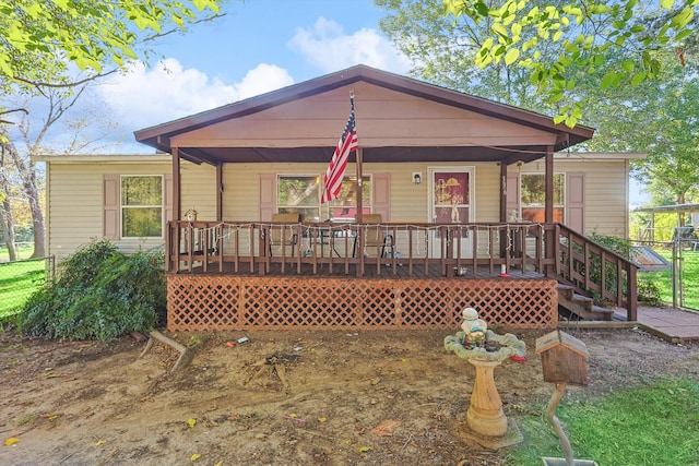 back of property with covered porch