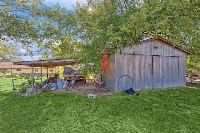 view of outdoor structure with a lawn