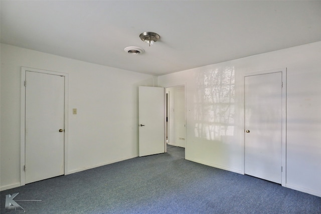 unfurnished bedroom with carpet flooring