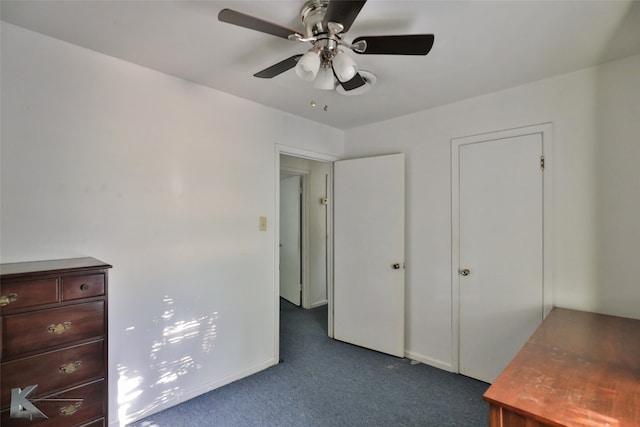 unfurnished bedroom with ceiling fan and carpet floors