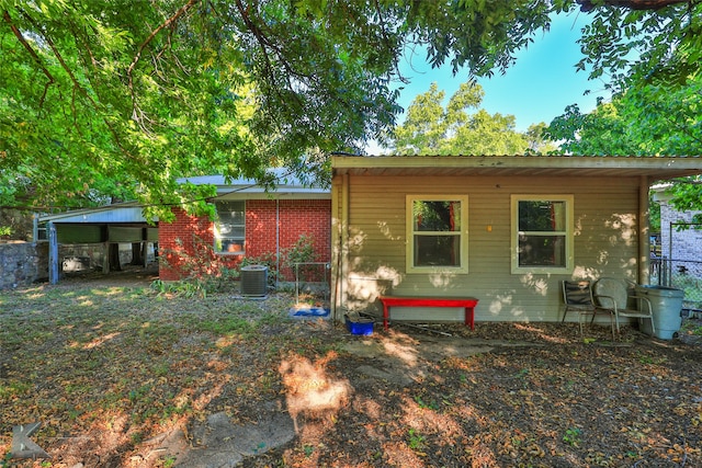 back of property featuring central air condition unit