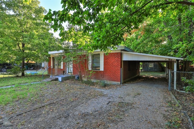 view of front of house featuring a carport