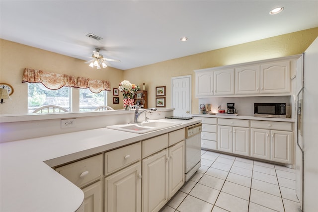 kitchen with light tile patterned floors, white cabinetry, white dishwasher, ceiling fan, and sink