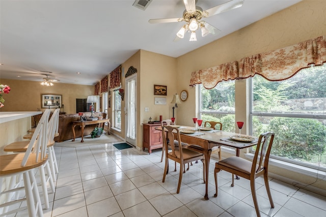 dining area featuring light tile patterned flooring and ceiling fan